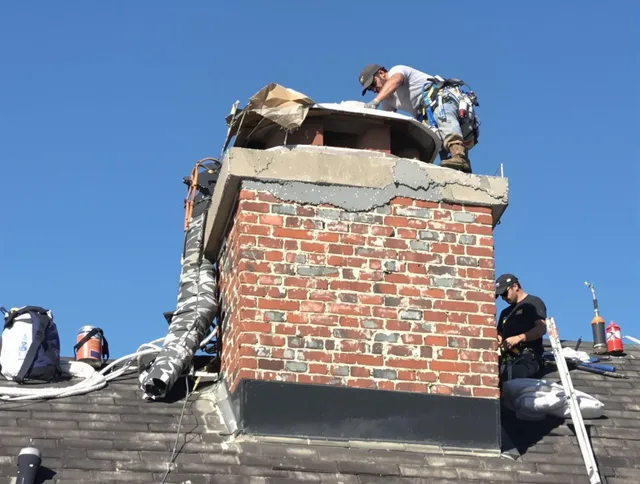 Boynton Beach Chimney Sweep installing a custom chimney crown in Boynton Beach, FL
