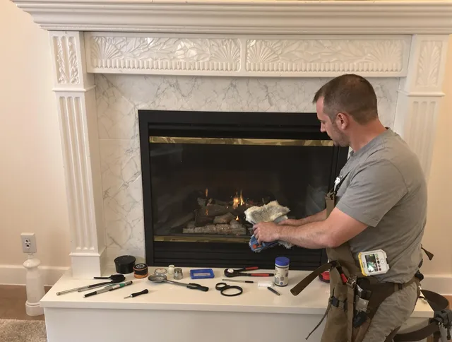 Boynton Beach Chimney Sweep performing fireplace maintenance in Boynton Beach, FL
