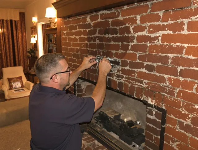 Boynton Beach Chimney Sweep expert fixing a fireplace in Boynton Beach, FL